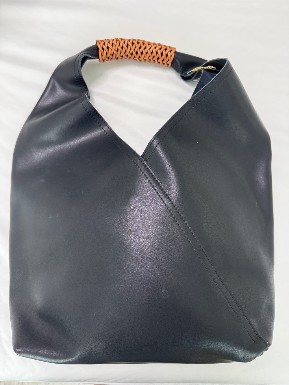 Sleek Black Leather Hobo Bag with Woven Tan Handle